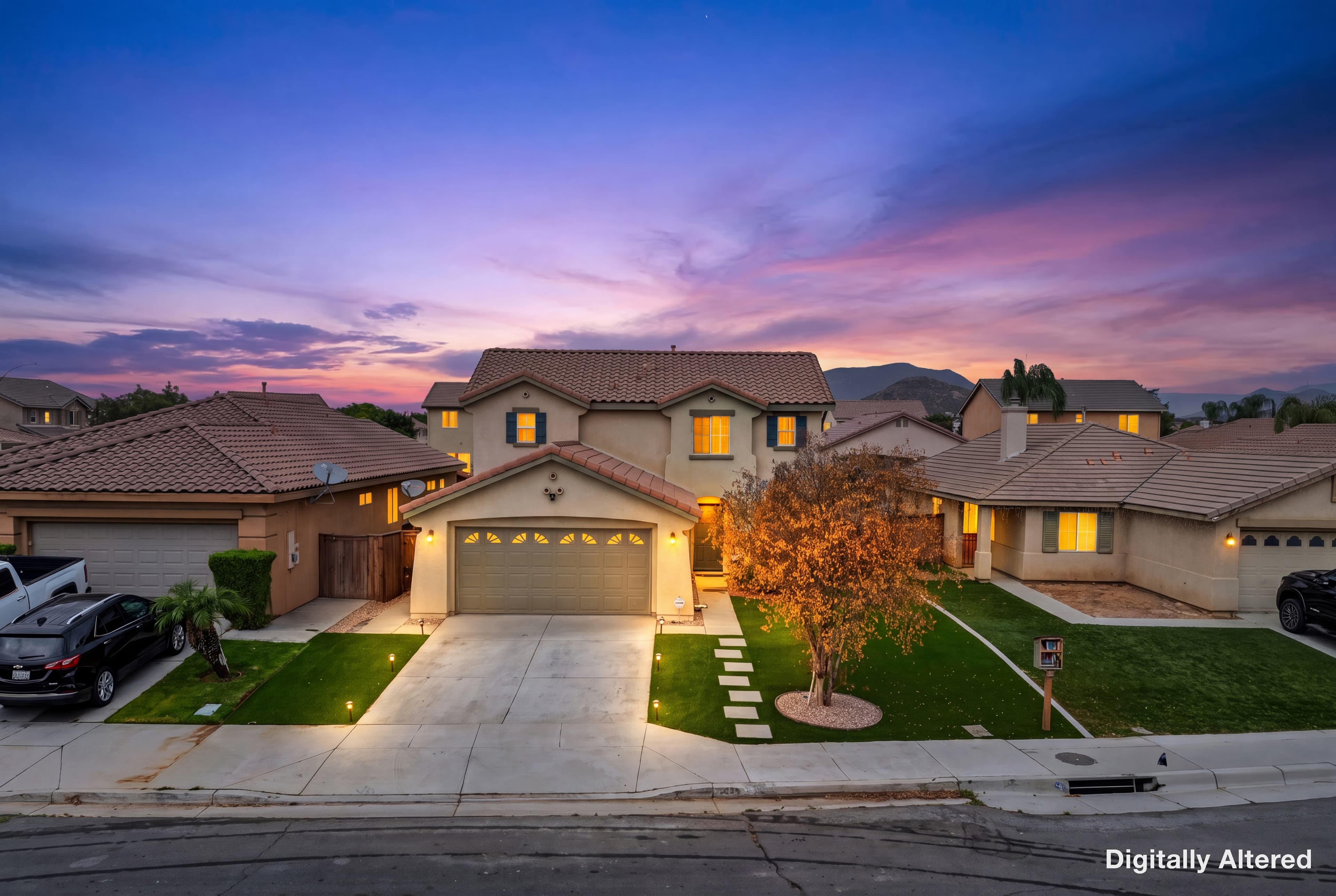 Front of the 2004 single family home at 1020 Marigold Dr in Perris, with artificial turf and hardscape in the front yard.